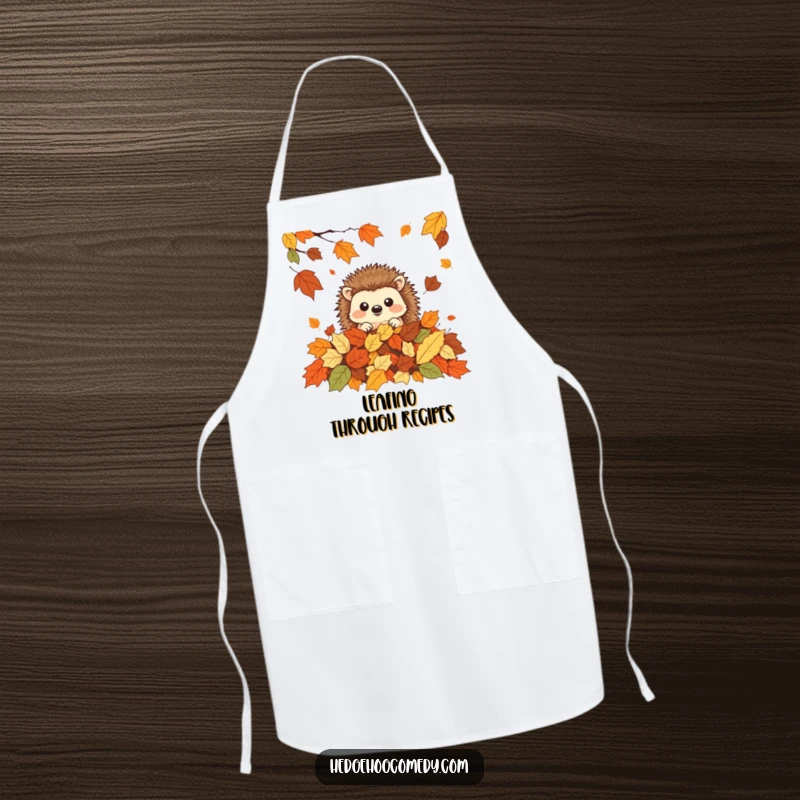 Funny cute kawaii hedgehog peeking from autumn leaves, ideal funny gift for cooks.