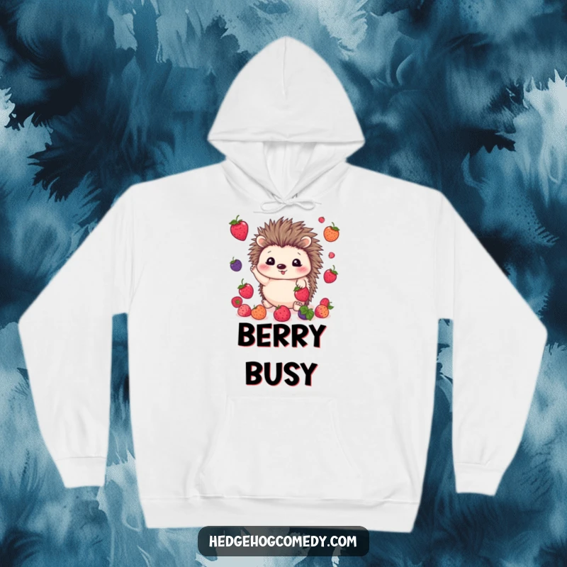 Funny kawaii hedgehog hoodie depicting a cute hedgehog happily juggling bright berries with its tiny paws and cheerful eyes.