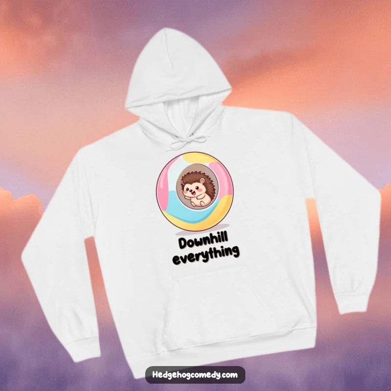 Funny kawaii hedgehog hoodie depicting a cute hedgehog excitedly rolling downhill inside a giant, colorful ball, full of glee.