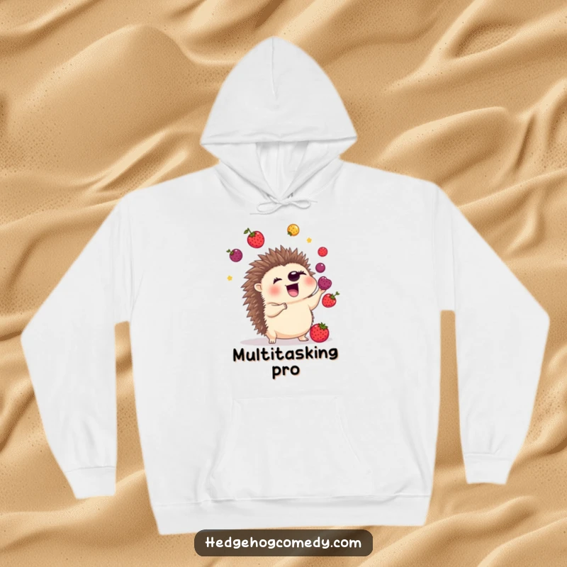 Funny hoodie featuring an excited hedgehog skillfully juggling colorful berries with its spiky quills, blending warmth with playful skill.