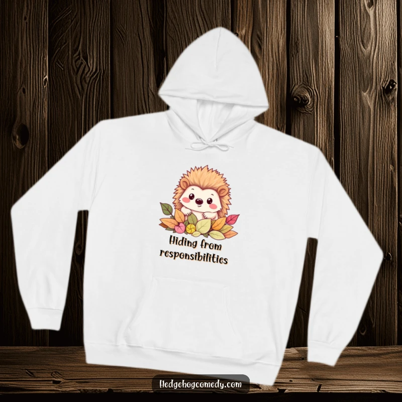 Funny Hoodie with a charming Kawaii hedgehog peeking with a smile from a delightful pile of autumn leaves.