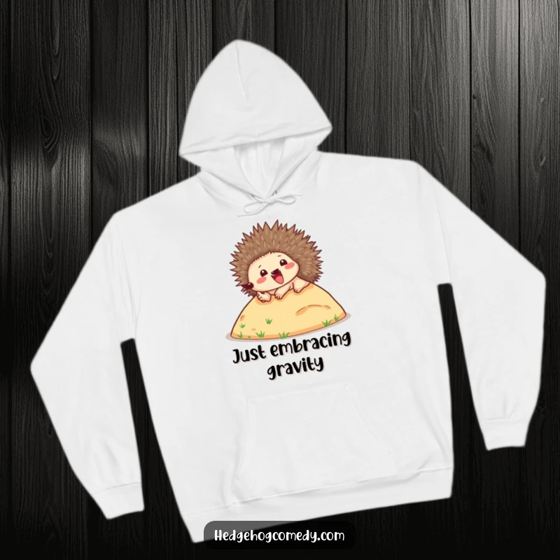 Funny hoodie featuring a delighted hedgehog enthusiastically tumbling down a slope, spines bristling, radiating pure fun and warmth.