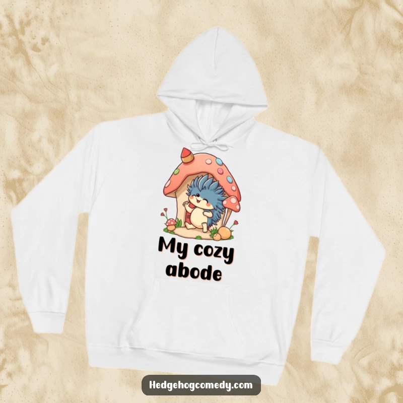Funny, warm hoodie featuring an excited hedgehog decorating a mushroom house, ideal for staying cozy while expressing creativity.