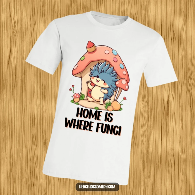 Funny t-shirt showing an excited hedgehog decorating a mushroom house, perfect for expressing a love for cozy, creative home spaces.