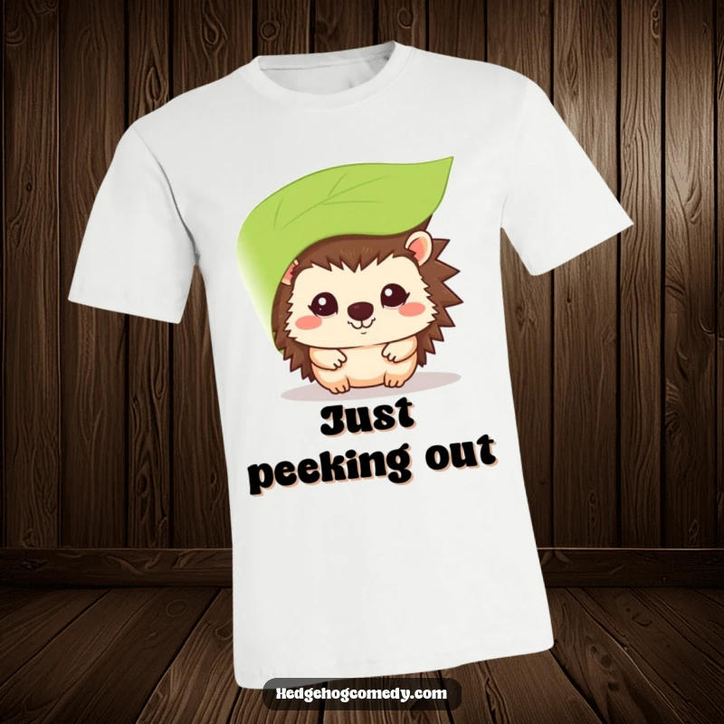 Funny kawaii hedgehog t-shirt, peeking shyly from behind a leaf, with a sweet, subtle smile.