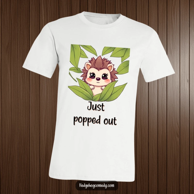 Funny hedgehog peeking through green leaves with a shocked expression on a t-shirt, capturing a humorous, cute surprise.