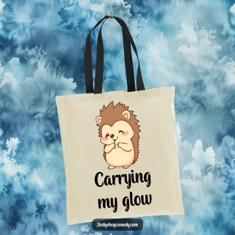 Funny tote bag featuring a happy hedgehog holding a glowing firefly, perfect for carrying daily items with a touch of magic.