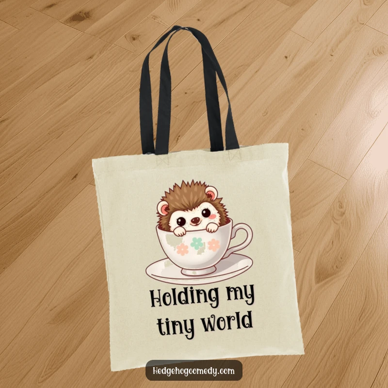 Funny Kawaii Hedgehog Tote Bag: A charming hedgehog peeking from a teacup, ready to hold your treasures with a shy grin.