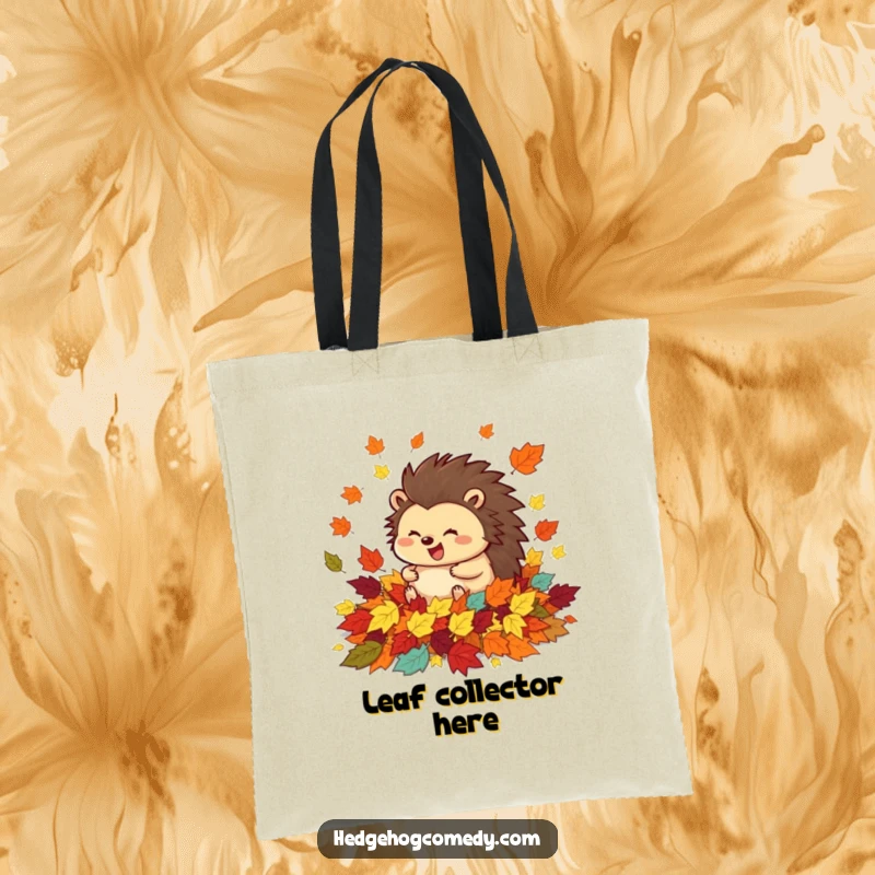 Funny tote bag featuring a happy hedgehog joyfully rolling in a pile of vibrant autumn leaves, a perfect accessory for the season.