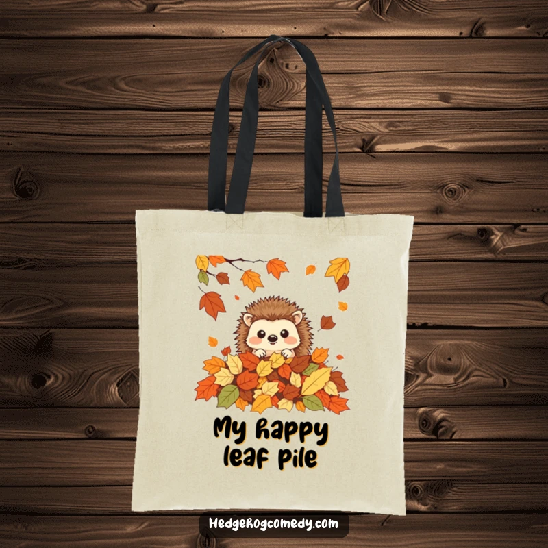 Funny cute kawaii hedgehog peeking from a pile of autumn leaves, ideal funny gift for shoppers.